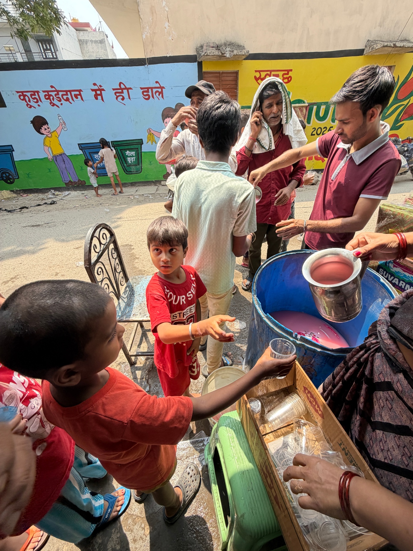 Volunteers serving chilled Rooh Afza sharbat to children and labourers in Jagriti Vihar, Ghaziabad on 2 June 2026
